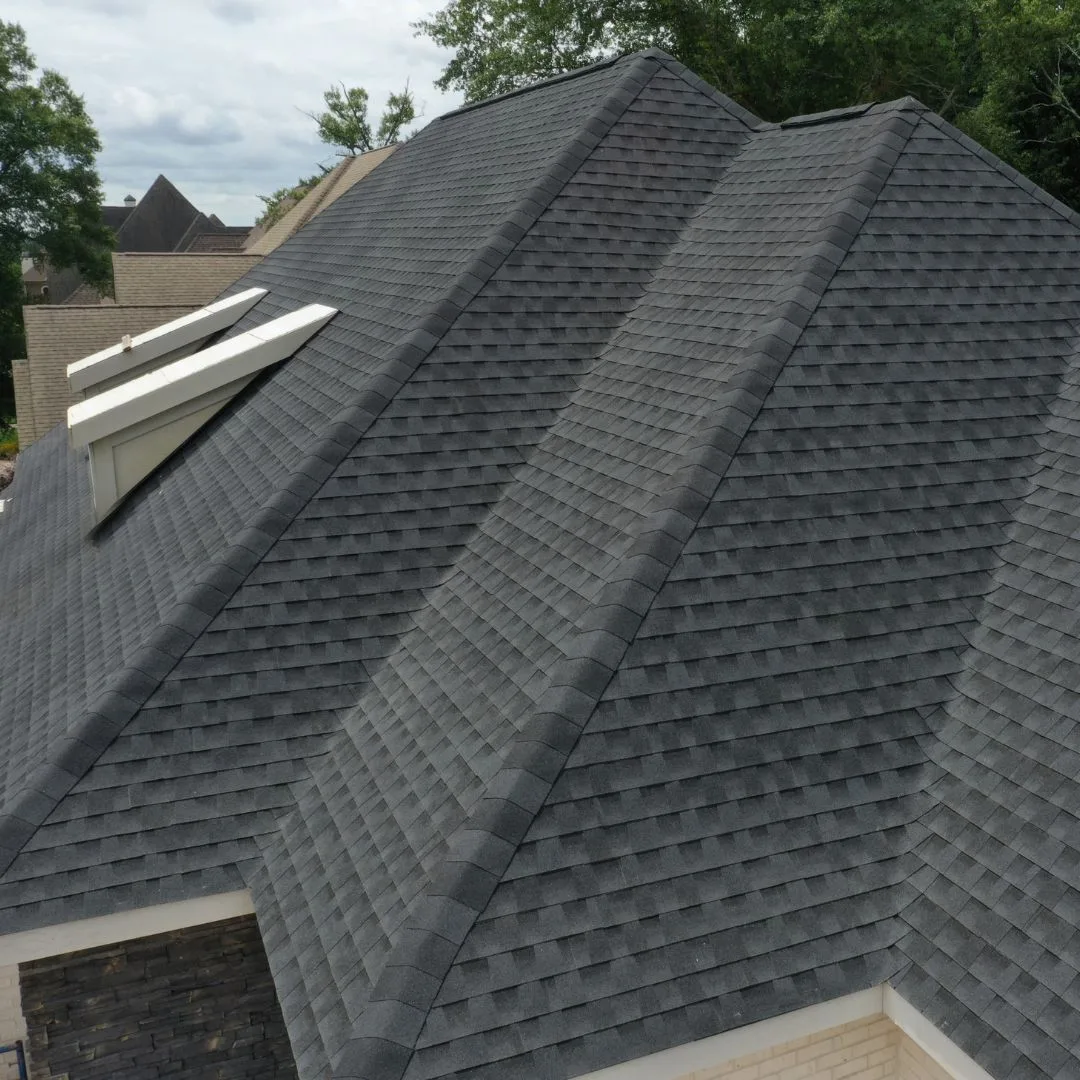 Aerial view of a newly installed architectural shingle roof on a home in Lake City, FL