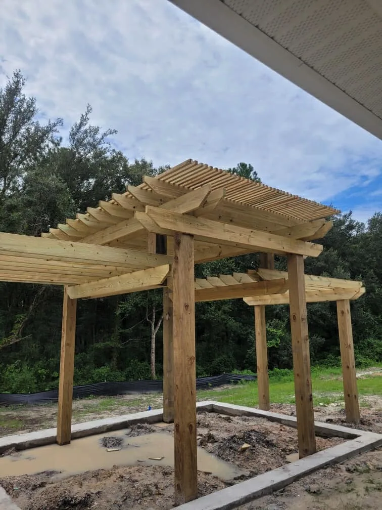Wooden pergola under construction on a Creative Concepts project
