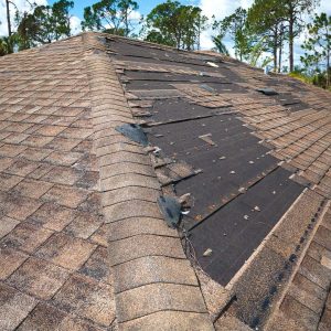 An image of a roof showing signs of significant storm damage in Florida.