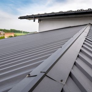 Metal roofing High Springs FL. A picture of a house with dark metal roofing. 